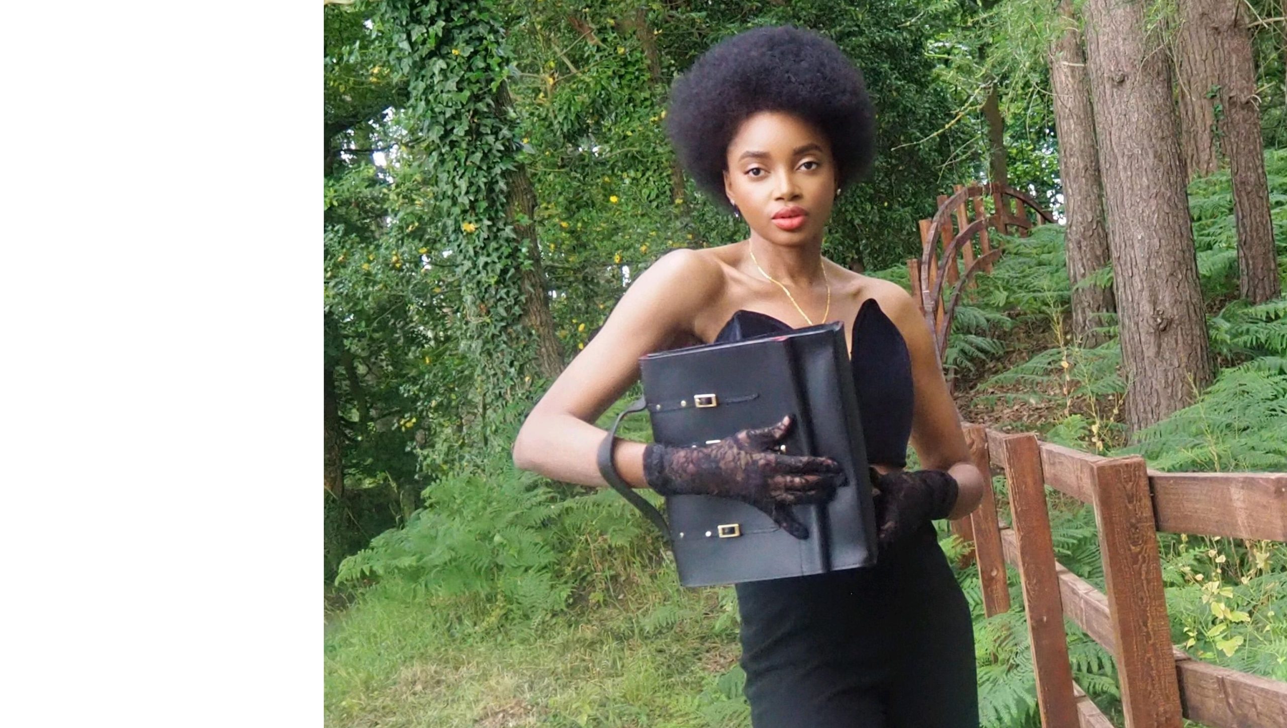 Website_slider final Model carrying a black leather handbag