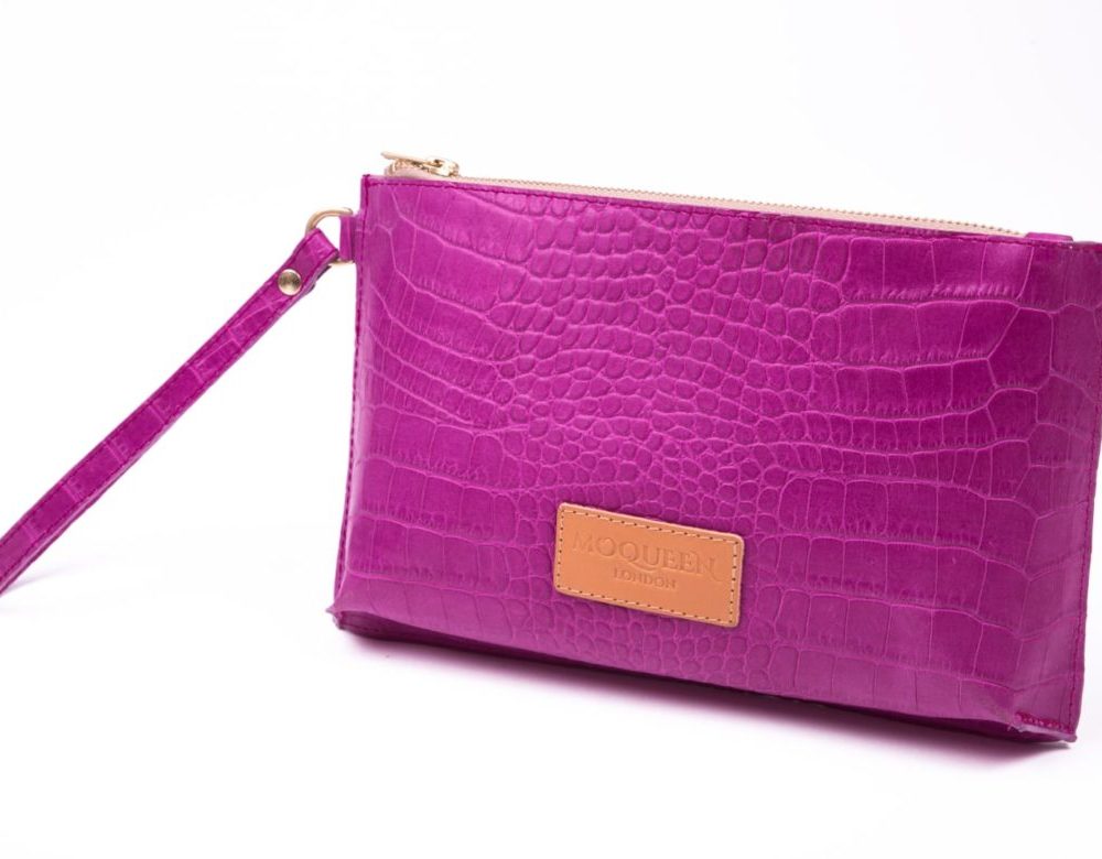 Front view of a fuchsia hot pink designer clutch bag