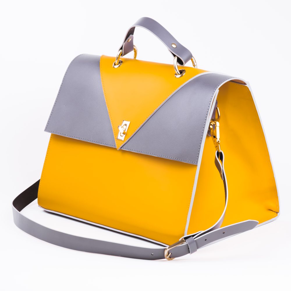 Side view of a canary yellow grey designer shoulder bag