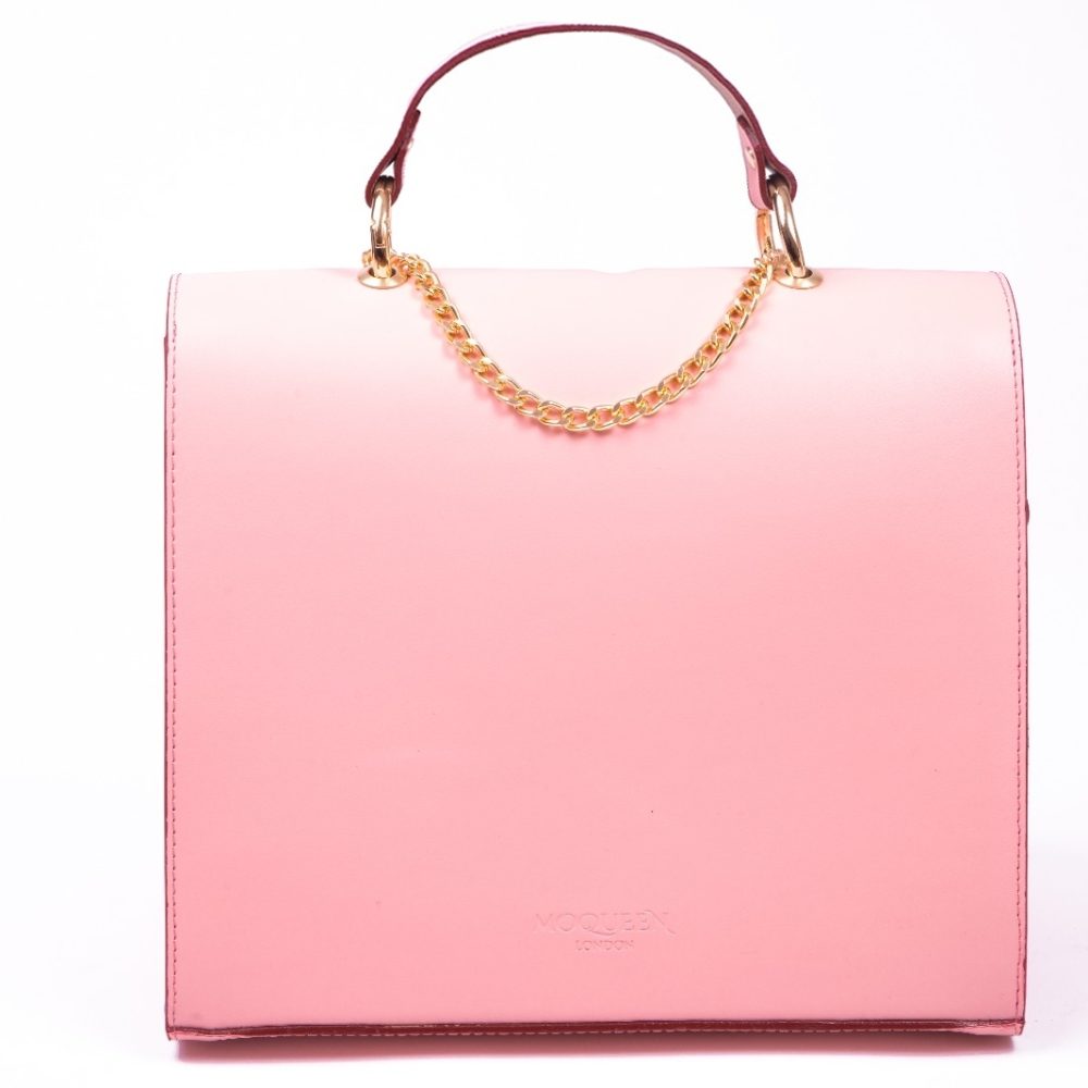 Back view of a oink leather shoulder bag with a flap chain