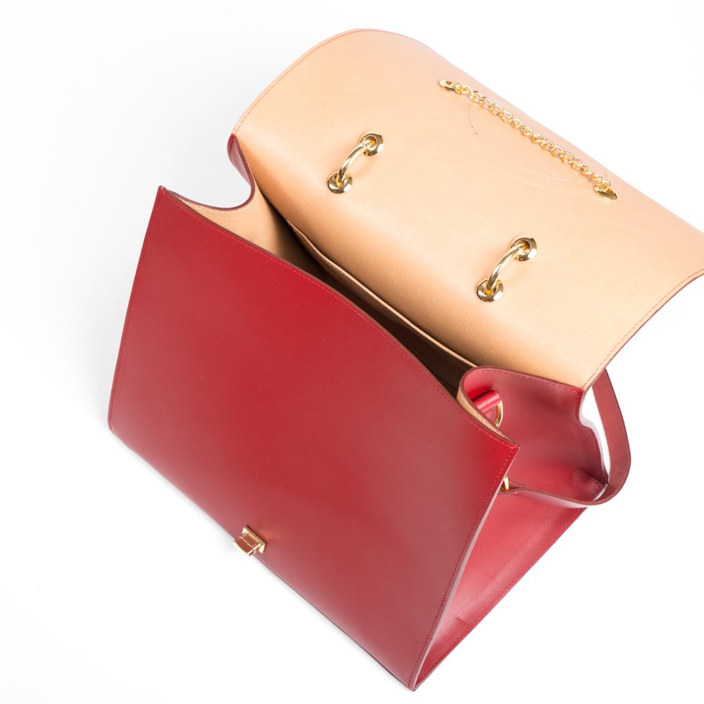 Interior view of ethical red handbag with inner side pocket