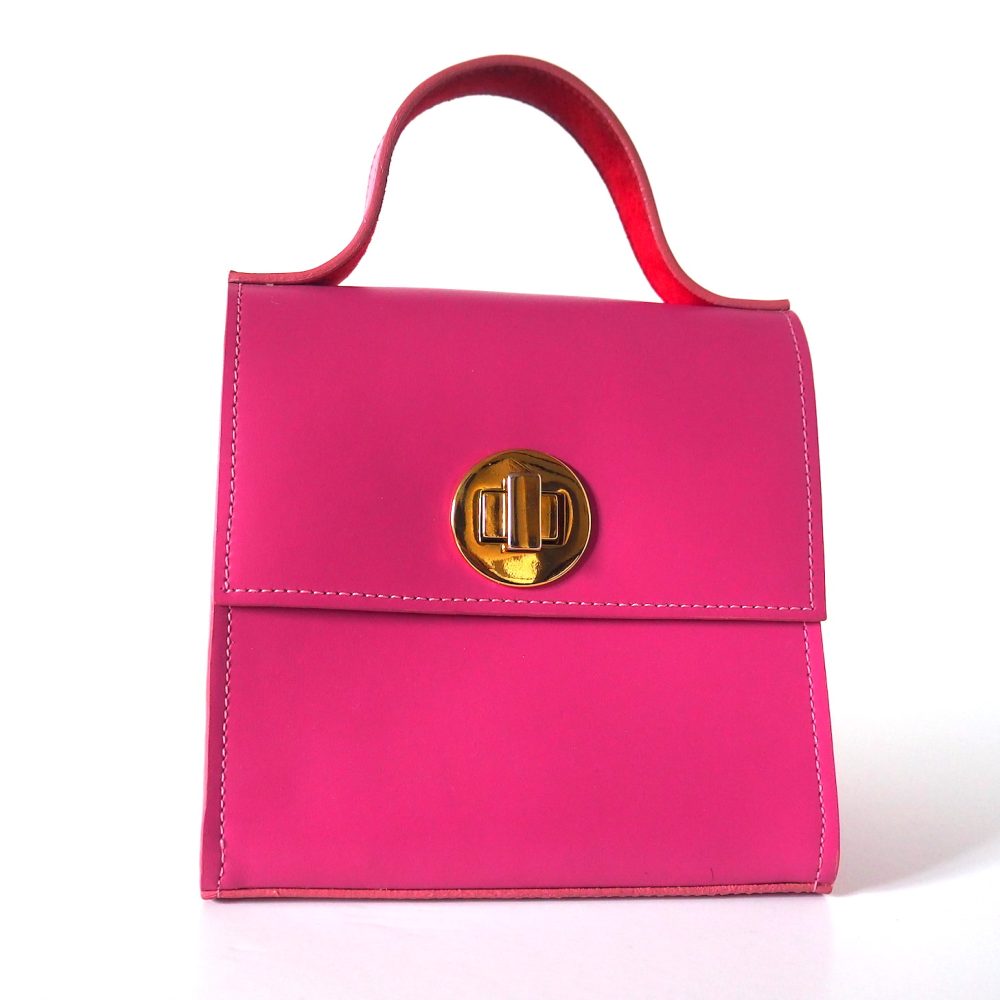 Front view of a berry pink small designer bag with an inner red lining